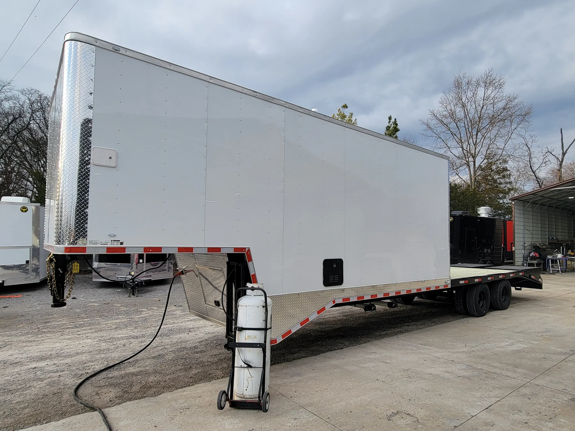 8.5' X 38' Custom Gooseneck Hybrid Equipment and Toy Hauler Trailer - Image 3