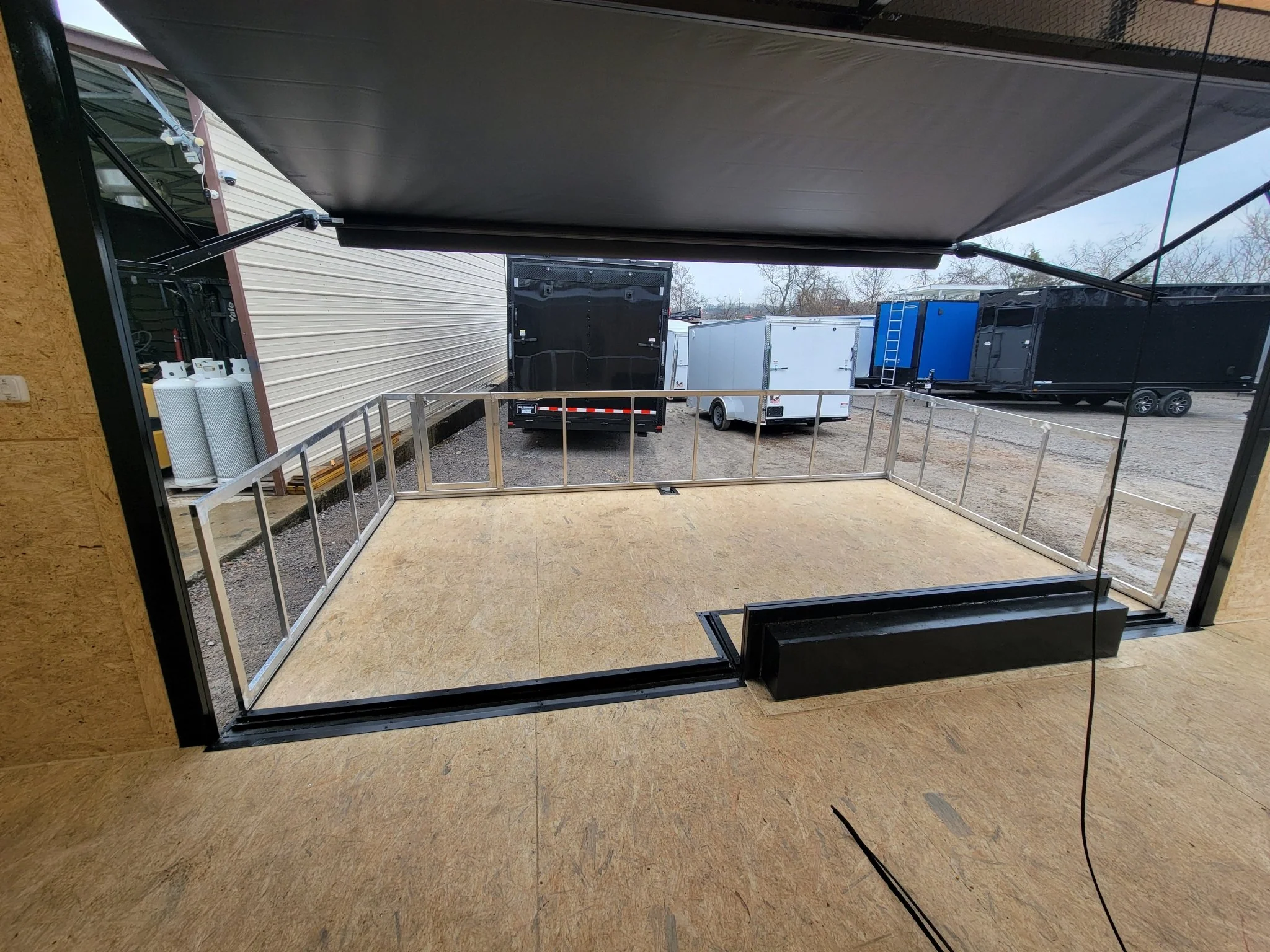 Custom Enclosed 8.5 X 24 Stage Trailer Black With Black Out Trim and Awning - Image 12